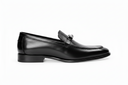 Black leather shoe on a white background