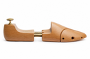 Wooden shoe stretchers on a white background
