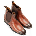 A pair of men's brown leather Chelsea boots with dark brown elastic side panels, shown from a high-angle view on a white background.